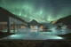 Reykjaböð Hot Springs con auroras boreales (Foto: Get Your Guide)